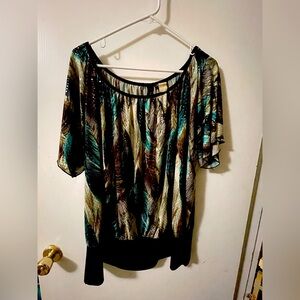 Dressy pullover blouse with a perfect bit of sparkle. Banded waistline.